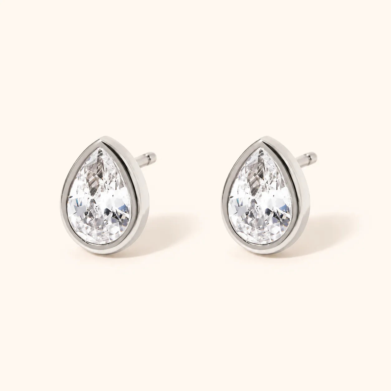 Pair of pink square-cut gemstones on a white background